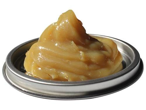 Light-colored polyurea and calcium industrial grease sample supplied by Morgan